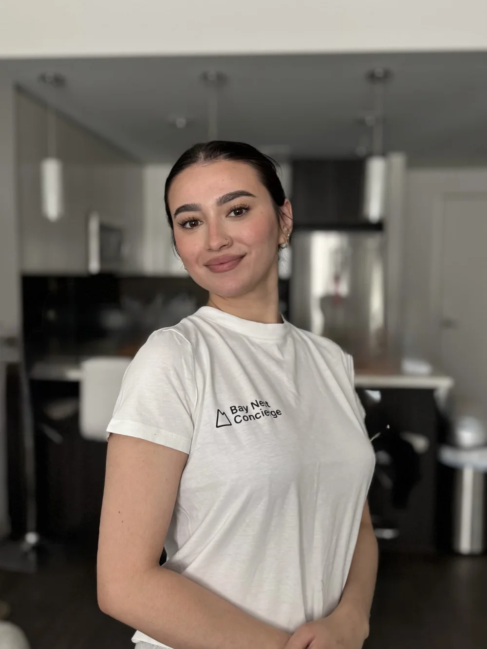 Adna de Mattos, founder of Bay Nest Concierge, in her Bay Nest shirt